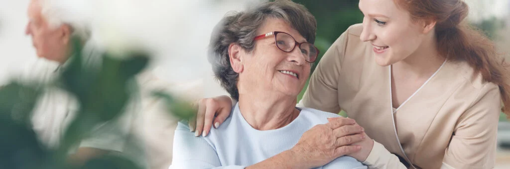 Old woman and young woman looking at each other. Atwell Care Ltd. Live in care. Home Care. Care Company. Bath. Frome. Keynsham. Saltford.